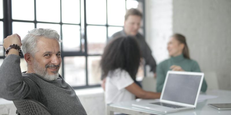 Group of diverse people communicating positively in an online forum.