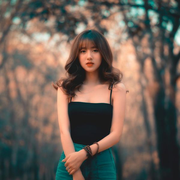 Person looking calm and focused in a bright, serene environment.